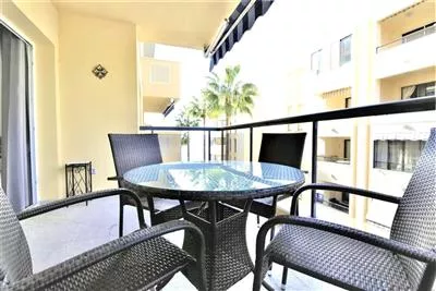 EC2_Lovely_balcony_with_outside_dining_area_for_four_and_partial_sea_views 2.JPG