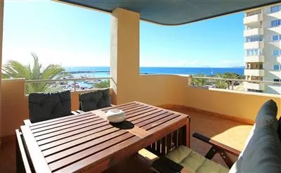 8._Lovely_south-west_balcony_with_outdoor_dining_area_and_sea_views.JPG